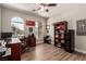 Home office with hardwood floors, lots of natural light, and a custom bookcase at 813 Bluebird Hill Ave, North Las Vegas, NV 89084