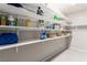 Shelves in a storage room, stocked with cleaning supplies and household items at 813 Bluebird Hill Ave, North Las Vegas, NV 89084