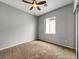 Neutral bedroom with carpeted flooring and a ceiling fan at 8267 Campbell Springs Ave, Las Vegas, NV 89178