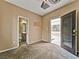 Neutral bedroom with carpet, an en-suite bathroom and private backyard access at 8267 Campbell Springs Ave, Las Vegas, NV 89178