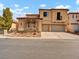 Beautiful two-story home featuring a tandem garage and stone accents at 8267 Campbell Springs Ave, Las Vegas, NV 89178