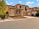 Charming two-story home with a stone facade and a well-manicured front yard at 8267 Campbell Springs Ave, Las Vegas, NV 89178