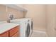 Functional laundry room featuring modern washer and dryer, plus ample counter space at 8267 Campbell Springs Ave, Las Vegas, NV 89178