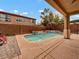Secluded pool area featuring a Tiki bar, lush landscaping, and a private pool at 8267 Campbell Springs Ave, Las Vegas, NV 89178