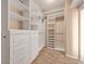 Bright walk-in closet featuring custom shelving with ample storage, ensuring organized space at 8267 Campbell Springs Ave, Las Vegas, NV 89178