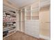 Spacious walk-in closet featuring custom shelving and drawers for optimal organization and storage at 8267 Campbell Springs Ave, Las Vegas, NV 89178