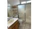 Bathroom featuring a shower with a glass door, toilet and vanity at 8328 Cimarron Ridge Dr, Las Vegas, NV 89128