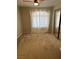 Bedroom featuring neutral walls and carpet, with white curtains and mirrored closet doors at 8328 Cimarron Ridge Dr, Las Vegas, NV 89128