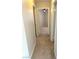 Hallway leading to a bedroom with neutral walls and carpet flooring at 8328 Cimarron Ridge Dr, Las Vegas, NV 89128