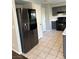 The kitchen has dark cabinets, stainless steel appliances, and spacious countertops at 8328 Cimarron Ridge Dr, Las Vegas, NV 89128