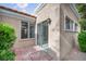 Cozy back patio with desert landscaping and access to the home through a sliding glass door at 8904 Evening Star Dr, Las Vegas, NV 89134