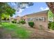The backyard features desert landscaping and a well-maintained lawn at 8904 Evening Star Dr, Las Vegas, NV 89134