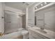 Bathroom featuring tiled floors, toilet, and a shower-tub combination with sliding doors at 8904 Evening Star Dr, Las Vegas, NV 89134