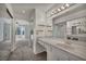 Bathroom with a single vanity, open shelving, and a view into an adjacent sitting room at 8904 Evening Star Dr, Las Vegas, NV 89134