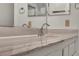 Bathroom detail featuring a close-up view of the sink and marble countertop at 8904 Evening Star Dr, Las Vegas, NV 89134
