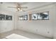 Bright bedroom with a ceiling fan and three windows allowing for lots of light at 8904 Evening Star Dr, Las Vegas, NV 89134
