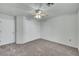 Spacious bedroom featuring neutral colored carpet, ceiling fan, and a large closet at 8904 Evening Star Dr, Las Vegas, NV 89134