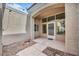 Private courtyard with tiled flooring, decorative rock and covered entryway at 8904 Evening Star Dr, Las Vegas, NV 89134