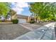 Well-maintained single-story home with a two-car garage and drought-tolerant landscaping at 8904 Evening Star Dr, Las Vegas, NV 89134