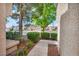 View of a sidewalk and exterior of home through an enclosed courtyard at 8904 Evening Star Dr, Las Vegas, NV 89134