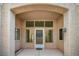 Covered front entry with multiple windows and door with decorative security screen at 8904 Evening Star Dr, Las Vegas, NV 89134