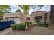 Charming single-story home featuring desert landscaping, a tile roof, and an attached two-car garage at 8904 Evening Star Dr, Las Vegas, NV 89134