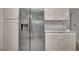 Bright kitchen featuring modern appliances, stainless steel refrigerator, and white cabinets at 8904 Evening Star Dr, Las Vegas, NV 89134