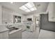Clean kitchen featuring white cabinets, stainless steel sink, and modern appliances at 8904 Evening Star Dr, Las Vegas, NV 89134