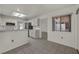 Well-lit kitchen featuring white cabinets, tile floors, and modern appliances at 8904 Evening Star Dr, Las Vegas, NV 89134