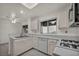 Spacious kitchen featuring modern appliances, white cabinets and bright natural light at 8904 Evening Star Dr, Las Vegas, NV 89134