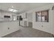 Bright kitchen featuring white cabinets, appliances, and neutral tile flooring for a clean, modern aesthetic at 8904 Evening Star Dr, Las Vegas, NV 89134