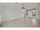 Spacious living room with tile flooring, high ceilings, and entrance to the private courtyard at 8904 Evening Star Dr, Las Vegas, NV 89134