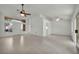 Bright living room with tile flooring, ceiling fans, and large windows offering ample natural light at 8904 Evening Star Dr, Las Vegas, NV 89134