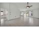 Large open living room with neutral tile, ceiling fan, and natural light at 8904 Evening Star Dr, Las Vegas, NV 89134