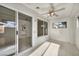 Bright sunroom with tile flooring, multiple windows, and sliding glass door to the exterior at 8904 Evening Star Dr, Las Vegas, NV 89134