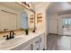 Stylish bathroom featuring double sinks, a wood-framed mirror and modern fixtures at 900 Heavenly Hills Ct # 112, Las Vegas, NV 89145