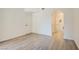 Bedroom with bright white walls, hardwood floors, and white doors leading to other spaces at 900 Heavenly Hills Ct # 112, Las Vegas, NV 89145