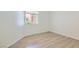 Bright bedroom with modern flooring and natural light from a window at 900 Heavenly Hills Ct # 112, Las Vegas, NV 89145