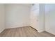 A well-lit bedroom with modern floors, closet, and fresh, neutral paint at 900 Heavenly Hills Ct # 112, Las Vegas, NV 89145