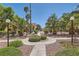 Community outdoor space with walkways, landscaping and seating in a well-maintained area at 900 Heavenly Hills Ct # 112, Las Vegas, NV 89145