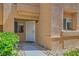 Charming condo entrance with a well-lit walkway leading to the front door at 900 Heavenly Hills Ct # 112, Las Vegas, NV 89145