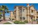 Beautiful condo with stucco exterior, complemented by a palm tree in a well-kept landscape at 900 Heavenly Hills Ct # 112, Las Vegas, NV 89145