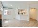 Bright living room featuring neutral paint, hardwood floors, a window, and an archway to the kitchen at 900 Heavenly Hills Ct # 112, Las Vegas, NV 89145