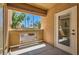 Private patio with views of lush landscaping and sunny blue sky at 900 Heavenly Hills Ct # 112, Las Vegas, NV 89145
