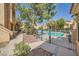 Relaxing community pool area surrounded by mature trees and well-manicured landscaping at 900 Heavenly Hills Ct # 112, Las Vegas, NV 89145