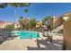 Community pool with lounge chairs offers a refreshing outdoor space for residents and guests to enjoy at 900 Heavenly Hills Ct # 112, Las Vegas, NV 89145