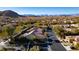 Scenic aerial view of a desert community with mountain views, showcasing the property's prime location at 9077 Creed Mountain Pl, Las Vegas, NV 89178