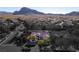 Aerial view of desert community emphasizing the home and highlighting the property's prime location at 9077 Creed Mountain Pl, Las Vegas, NV 89178