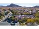 Gorgeous aerial view of a desert community with mountain views, highlighting the property's prime location at 9077 Creed Mountain Pl, Las Vegas, NV 89178
