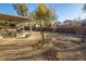 Low maintenance backyard with desert landscaping and covered patio, perfect for outdoor entertaining and relaxation at 9077 Creed Mountain Pl, Las Vegas, NV 89178
